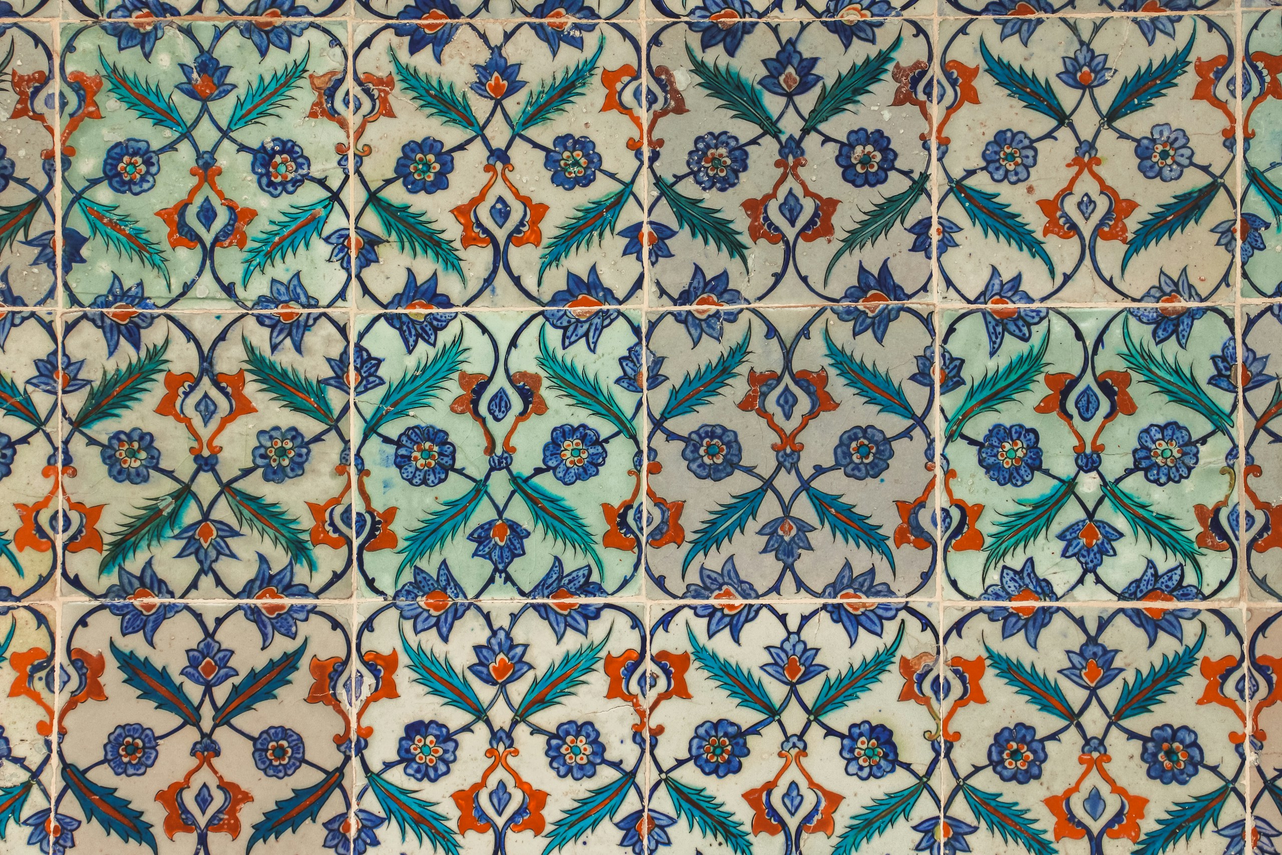 white blue and brown floral textile