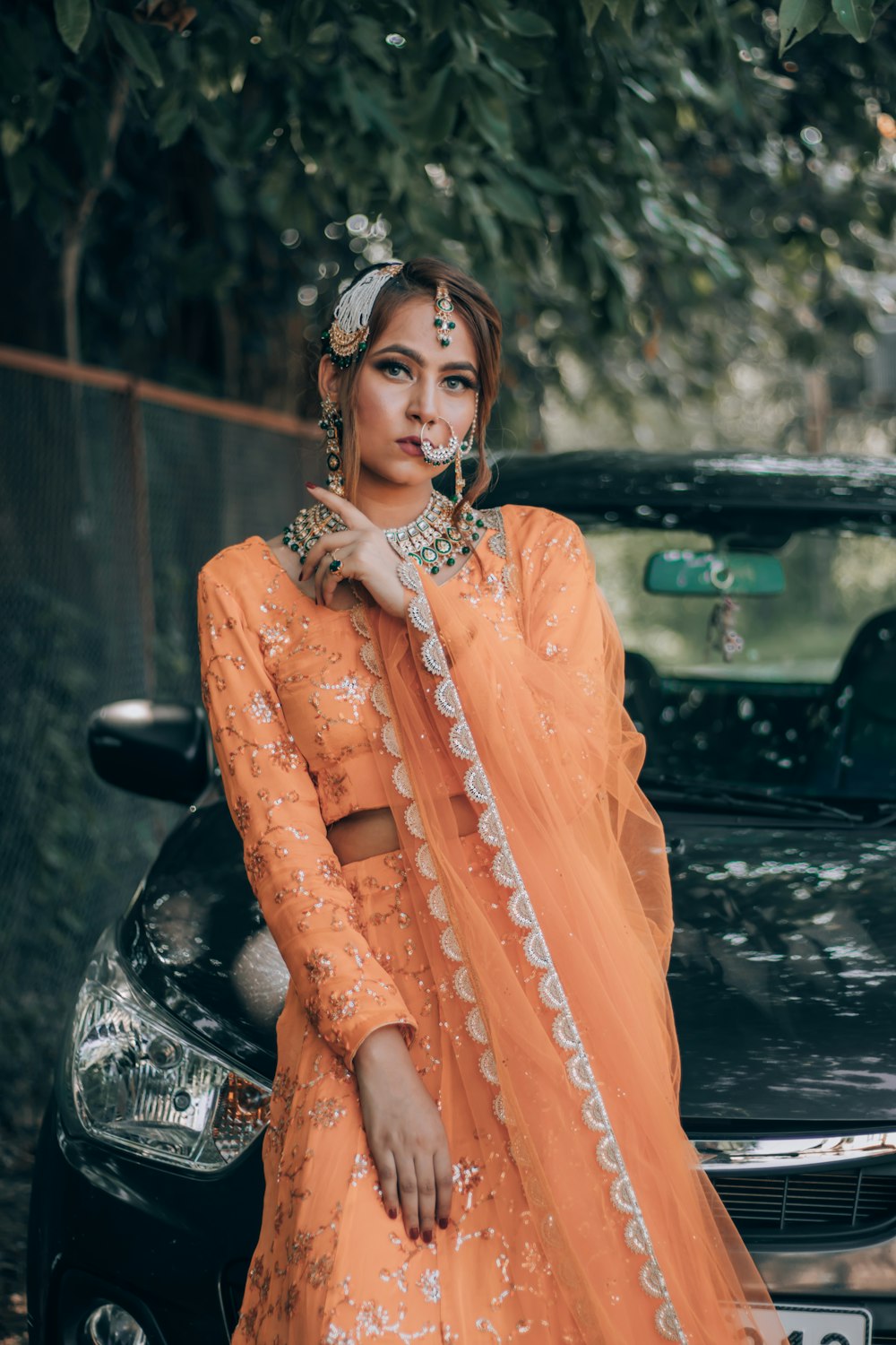 woman in orange dress wearing silver necklace