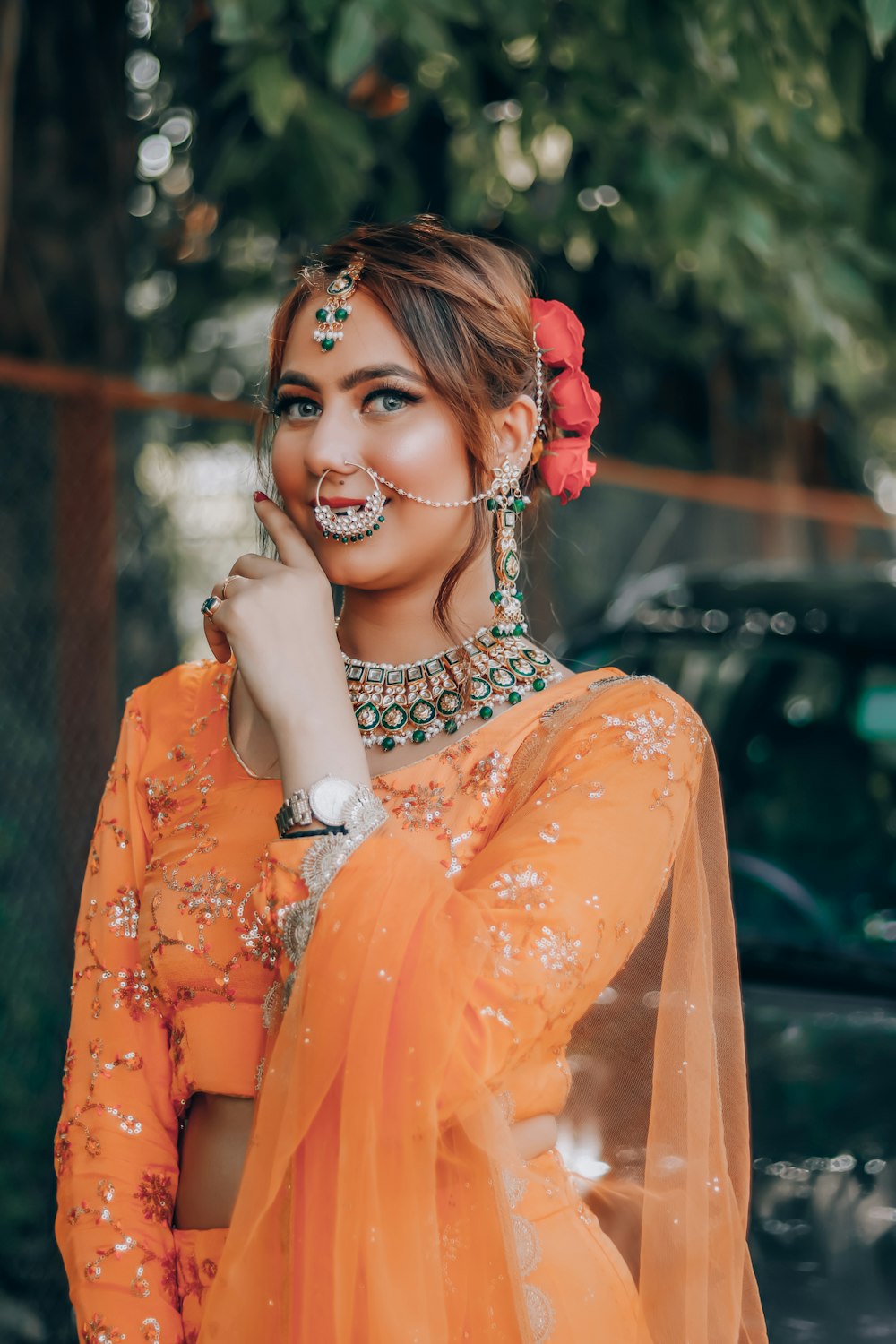 woman in orange dress wearing silver necklace
