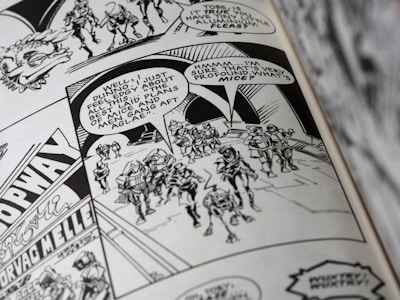 A black and white comic book page featuring a group of armored characters walking together. Speech bubbles contain dialogue, and the background displays some architectural details and signage.