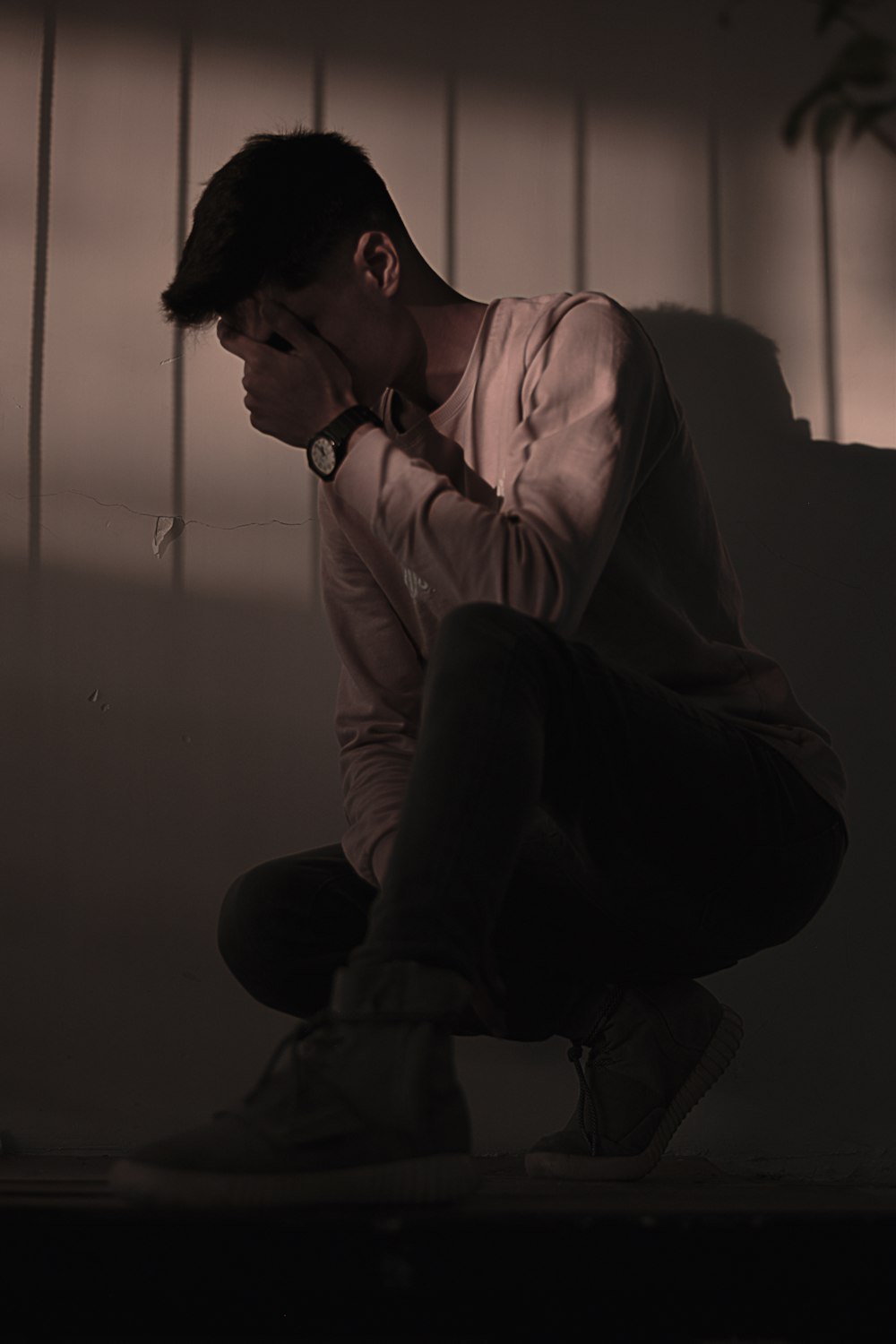 man in white dress shirt sitting on couch