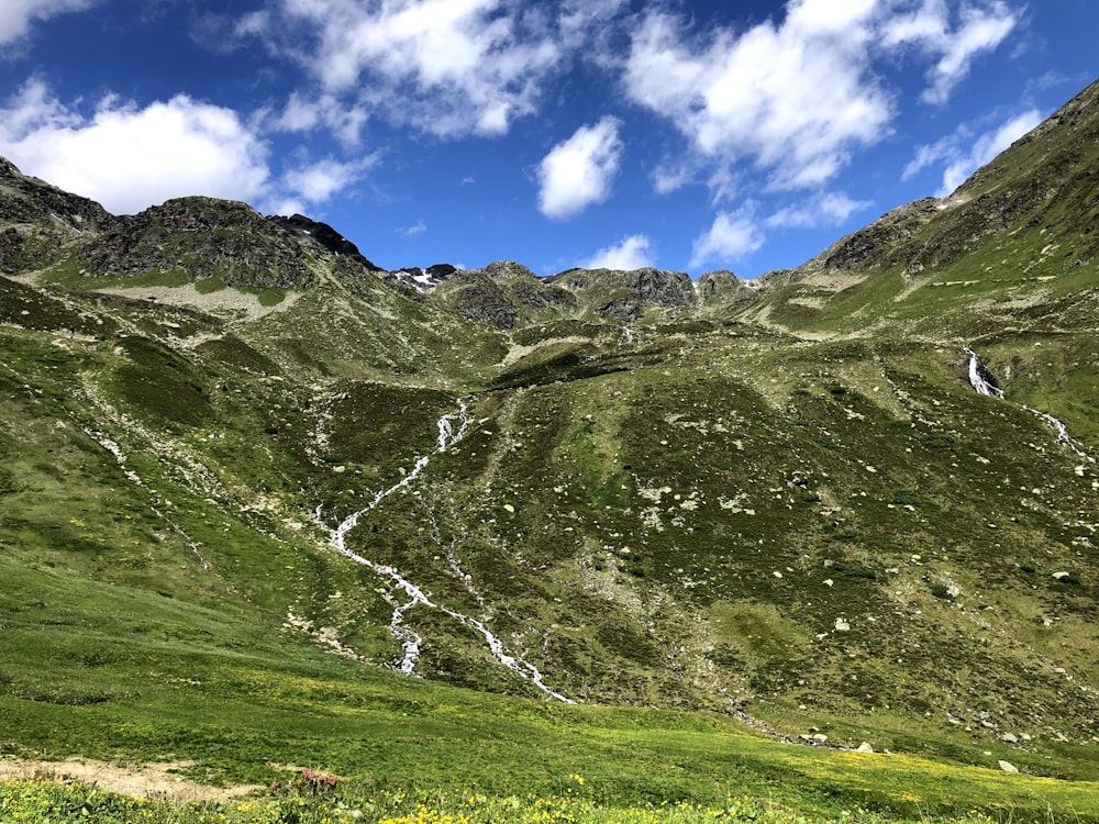 green and brown mountain under blue sky during daytime