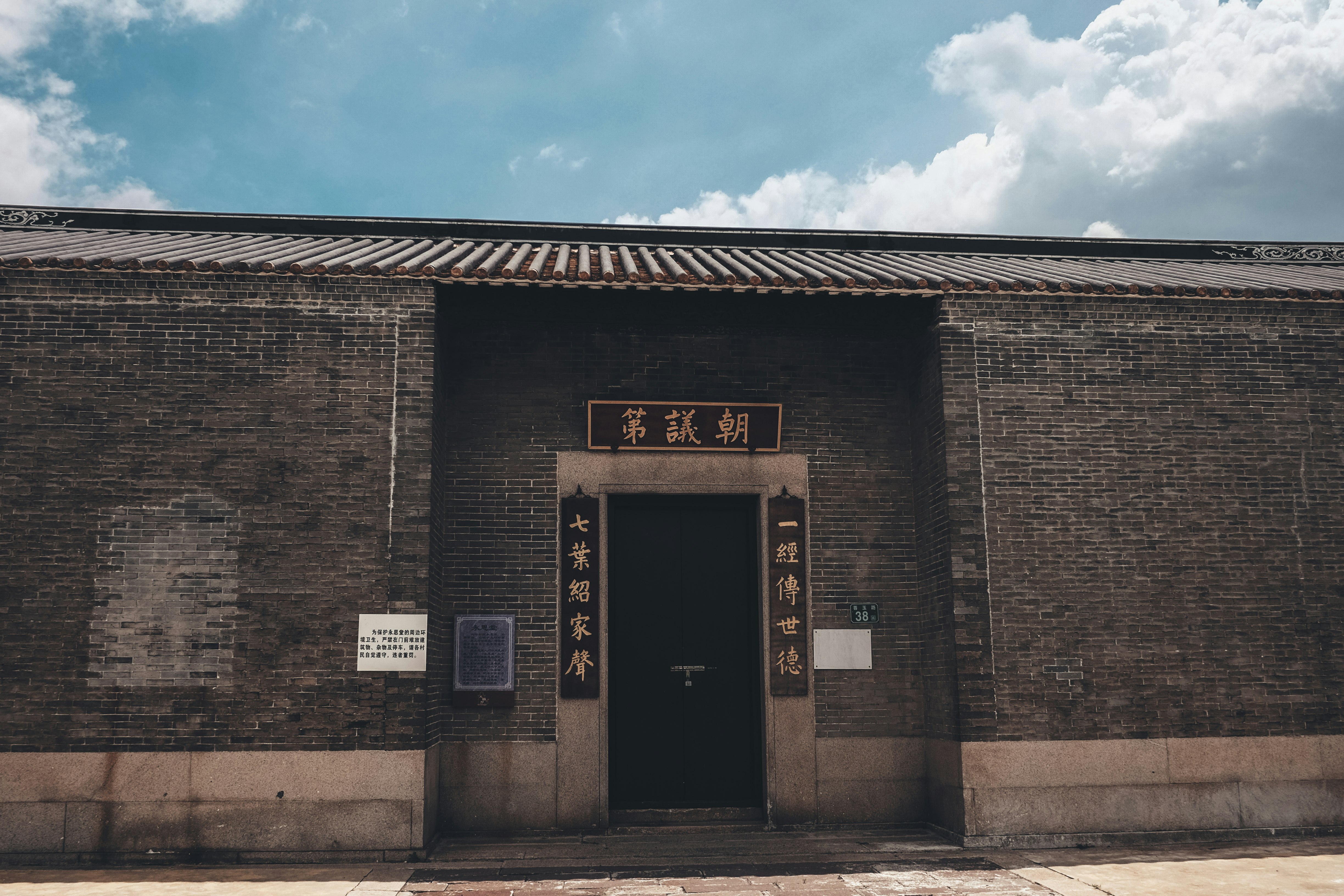 brown brick building under blue sky during daytime