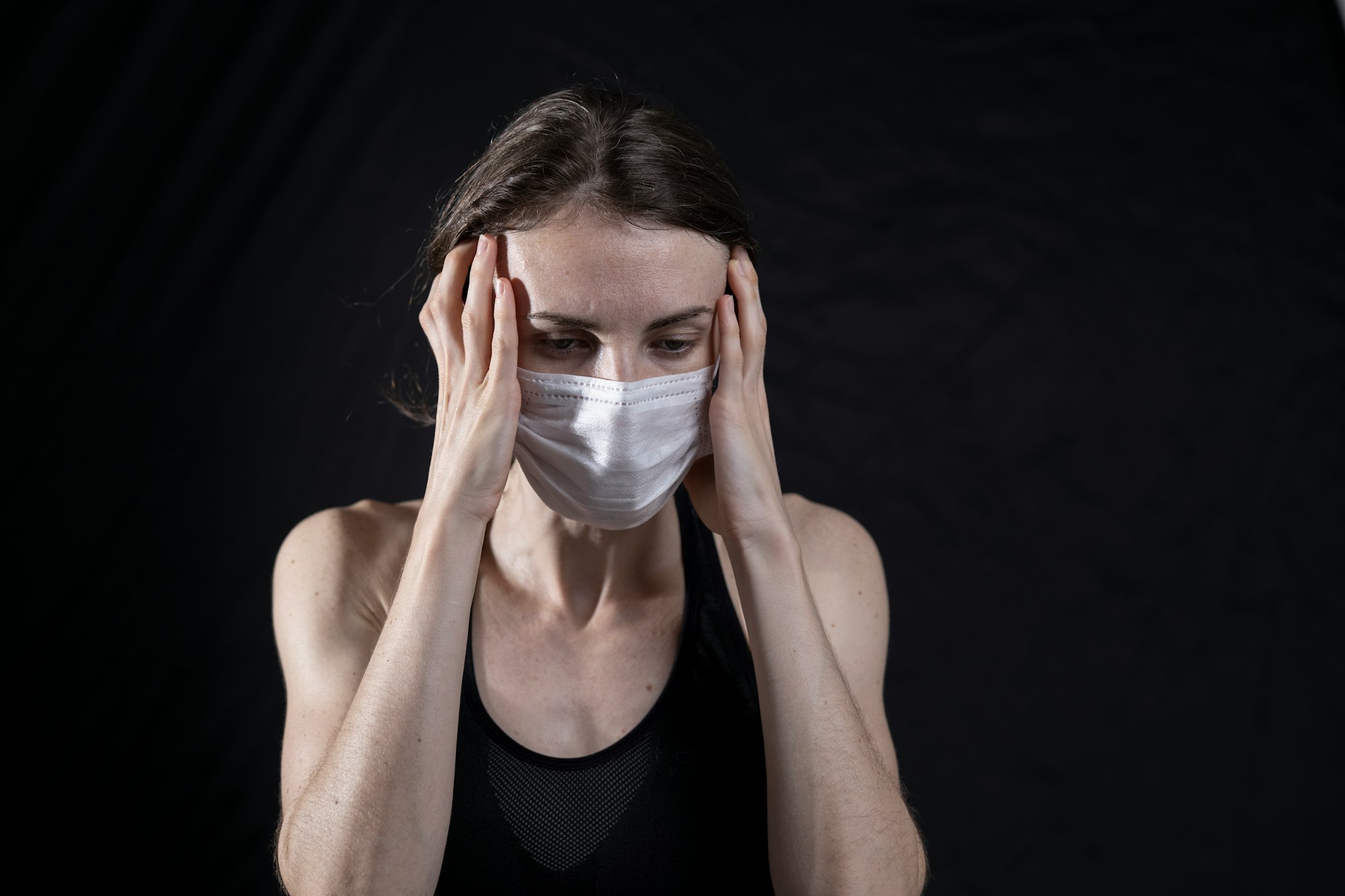young woman and coronavirus mask