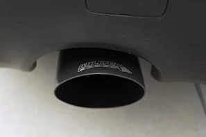 Detailed image of a handcrafted MIG-welded exhaust tip with a matte black finish
