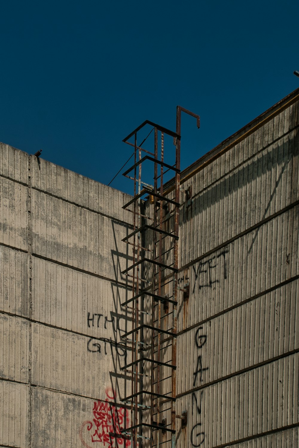 gray metal frame under blue sky during daytime