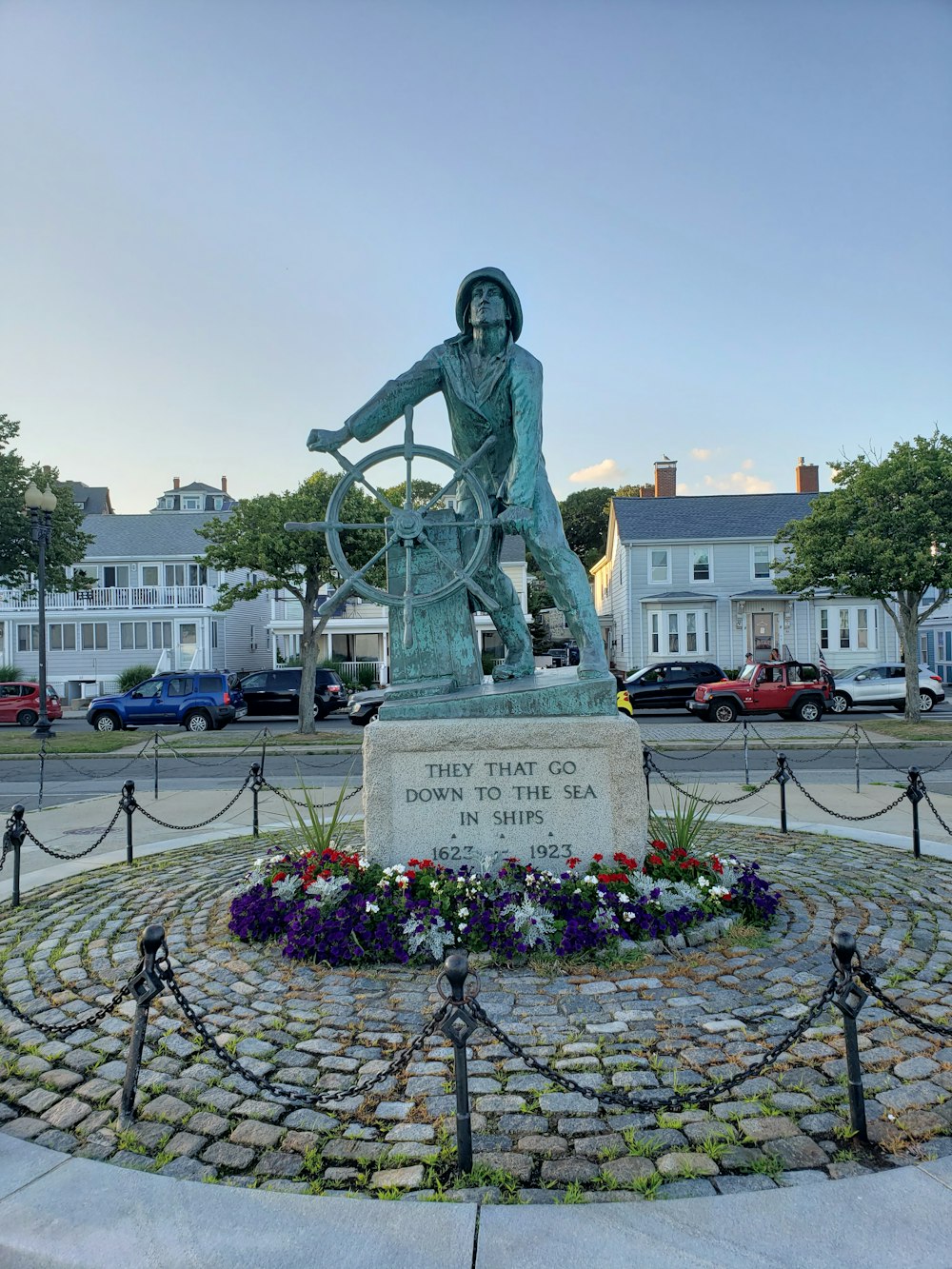 statue of man on top of building