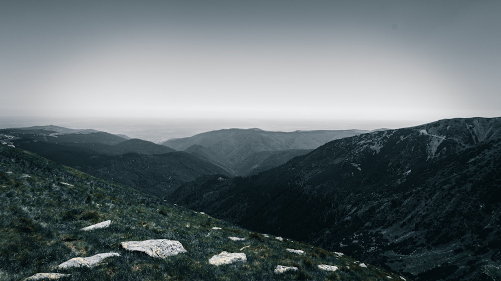 green and brown mountains under white sky during daytime