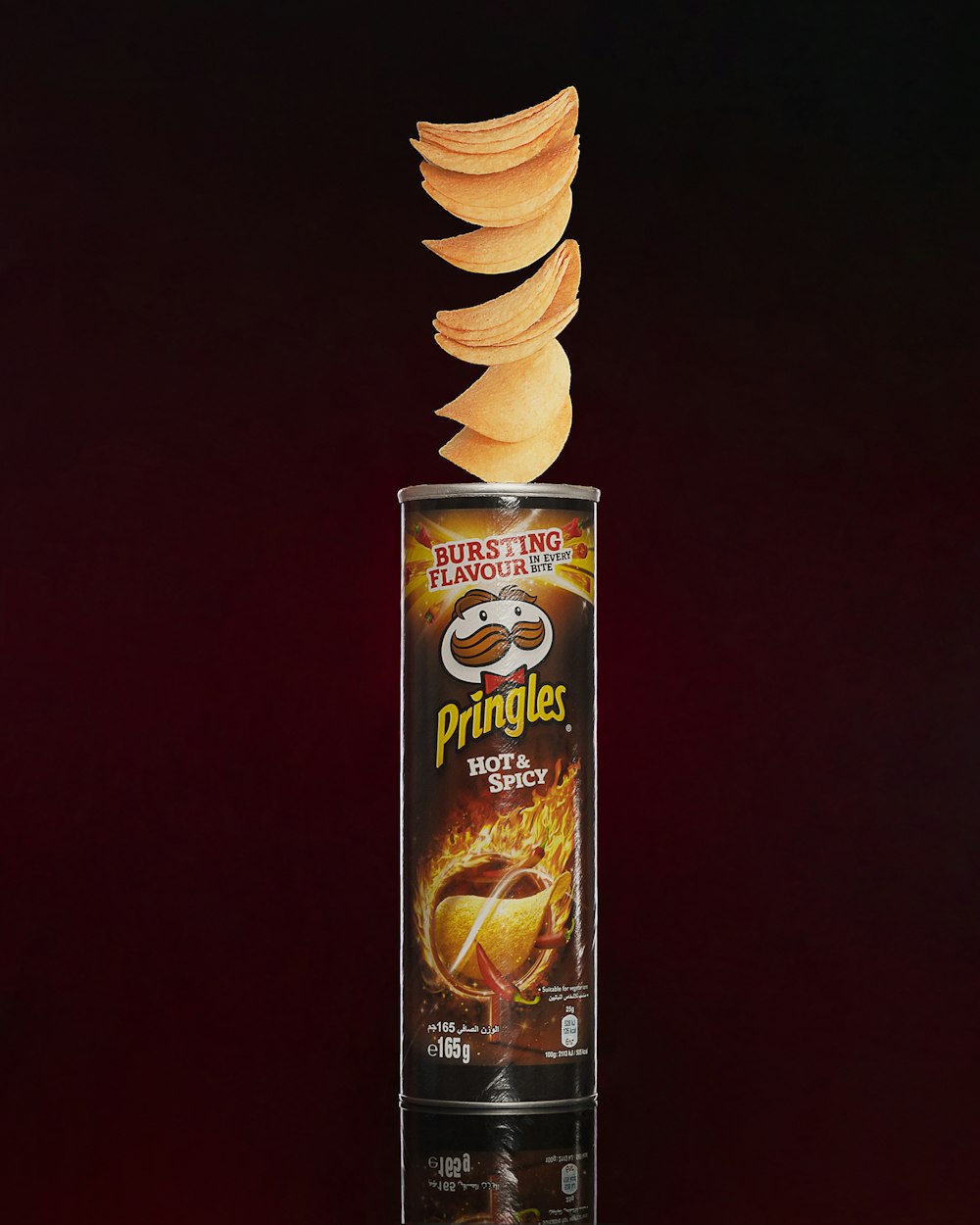 a can of pringles on a dark background