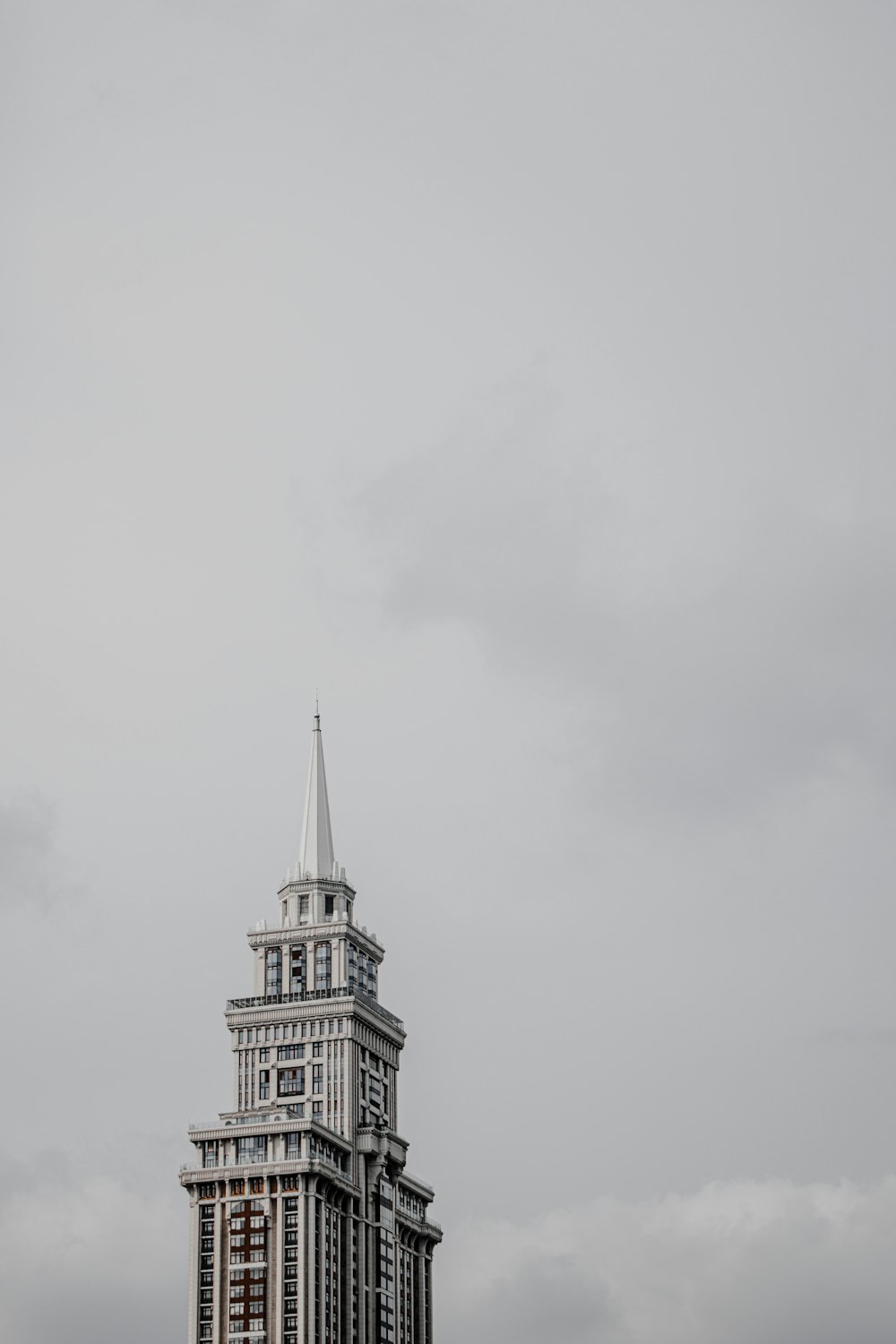 white concrete building under white sky during daytime