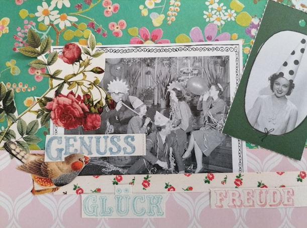 A collage featuring a black-and-white photograph of people in party hats, blowing up balloons and appearing to celebrate. The image is decorated with vintage floral patterns, roses, and cutouts of birds. Text is also included, with words like 'GENUSS', 'GL&Uuml;CK', and 'FREUDE' in pastel colors.