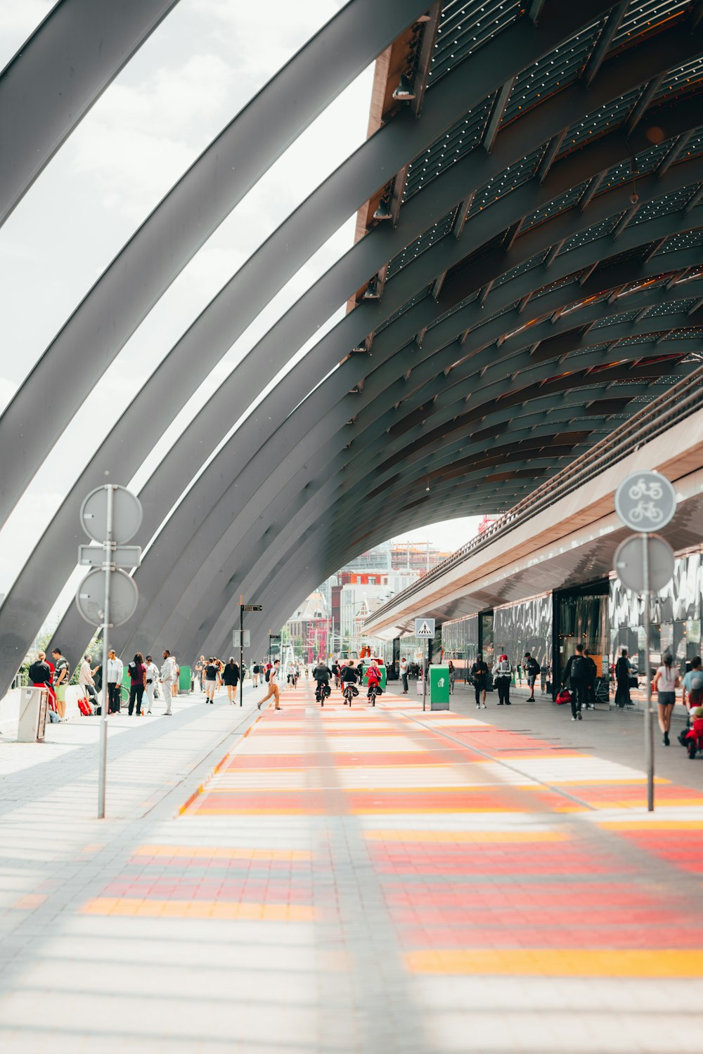 people walking on white and brown floor tiles