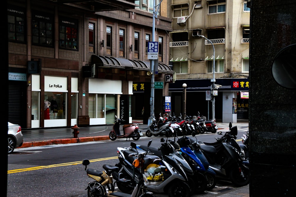 parked motorcycles near building during daytime