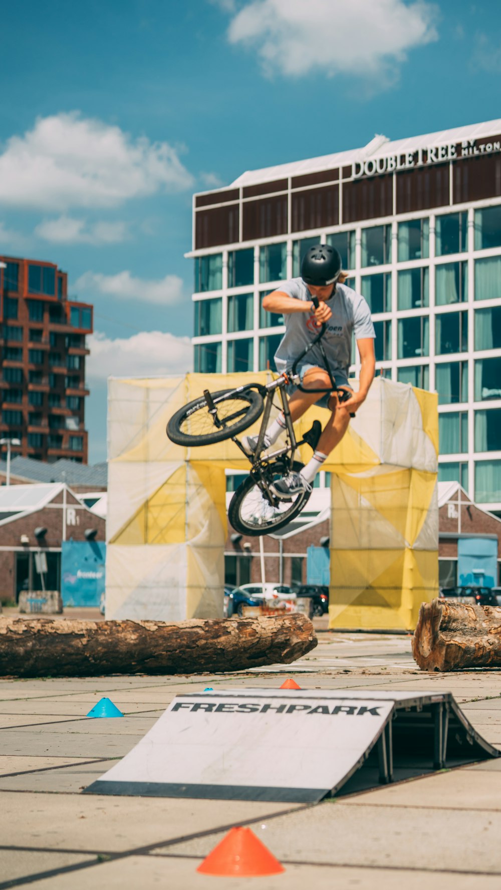 man in white t-shirt riding bicycle during daytime