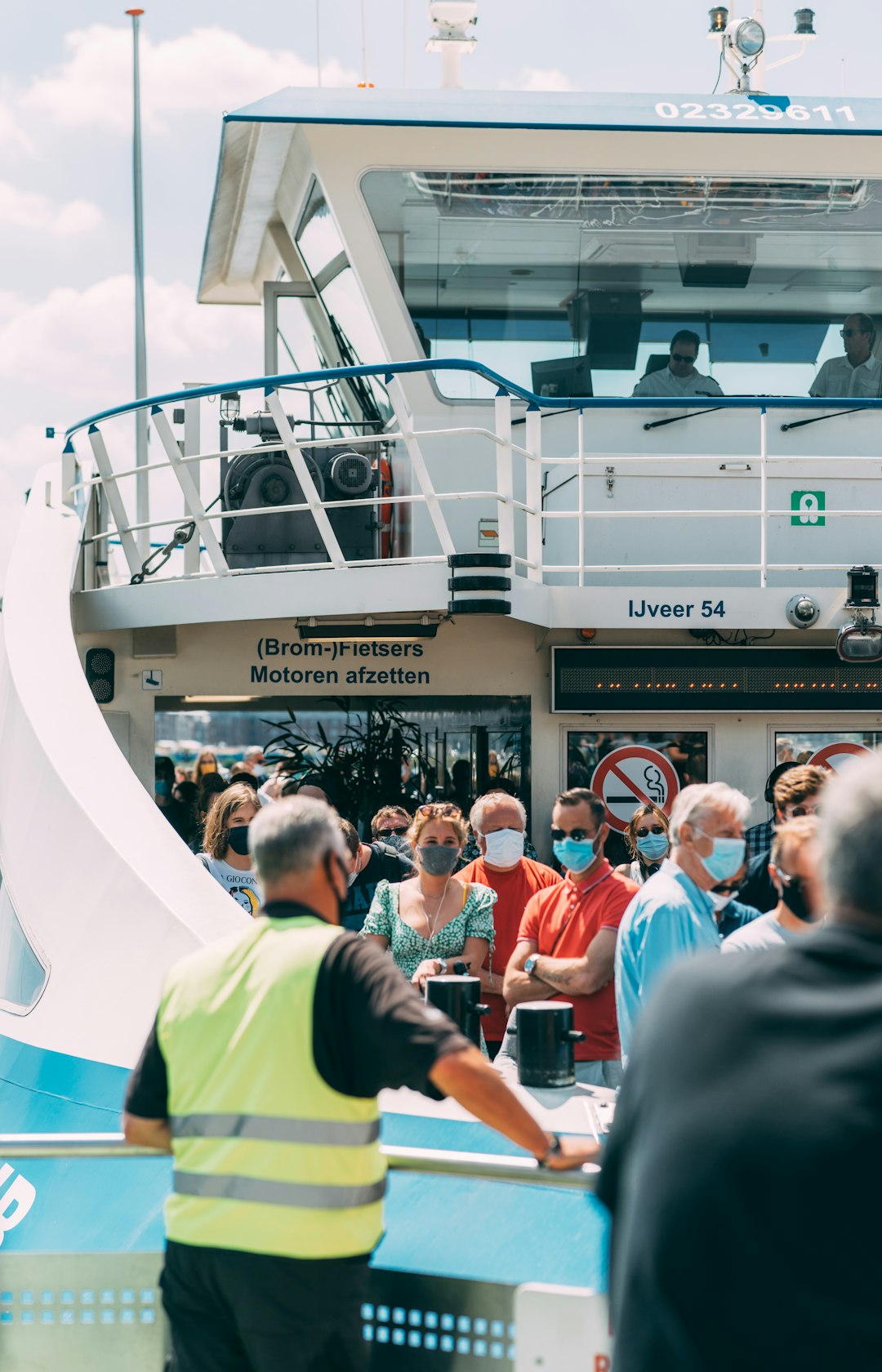 people standing in front of white building during daytime