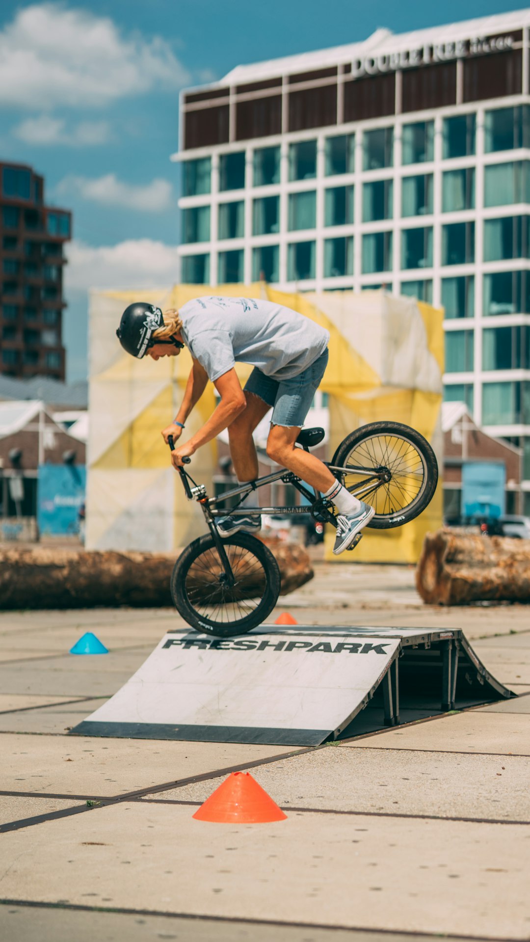 man in white shirt riding bicycle during daytime