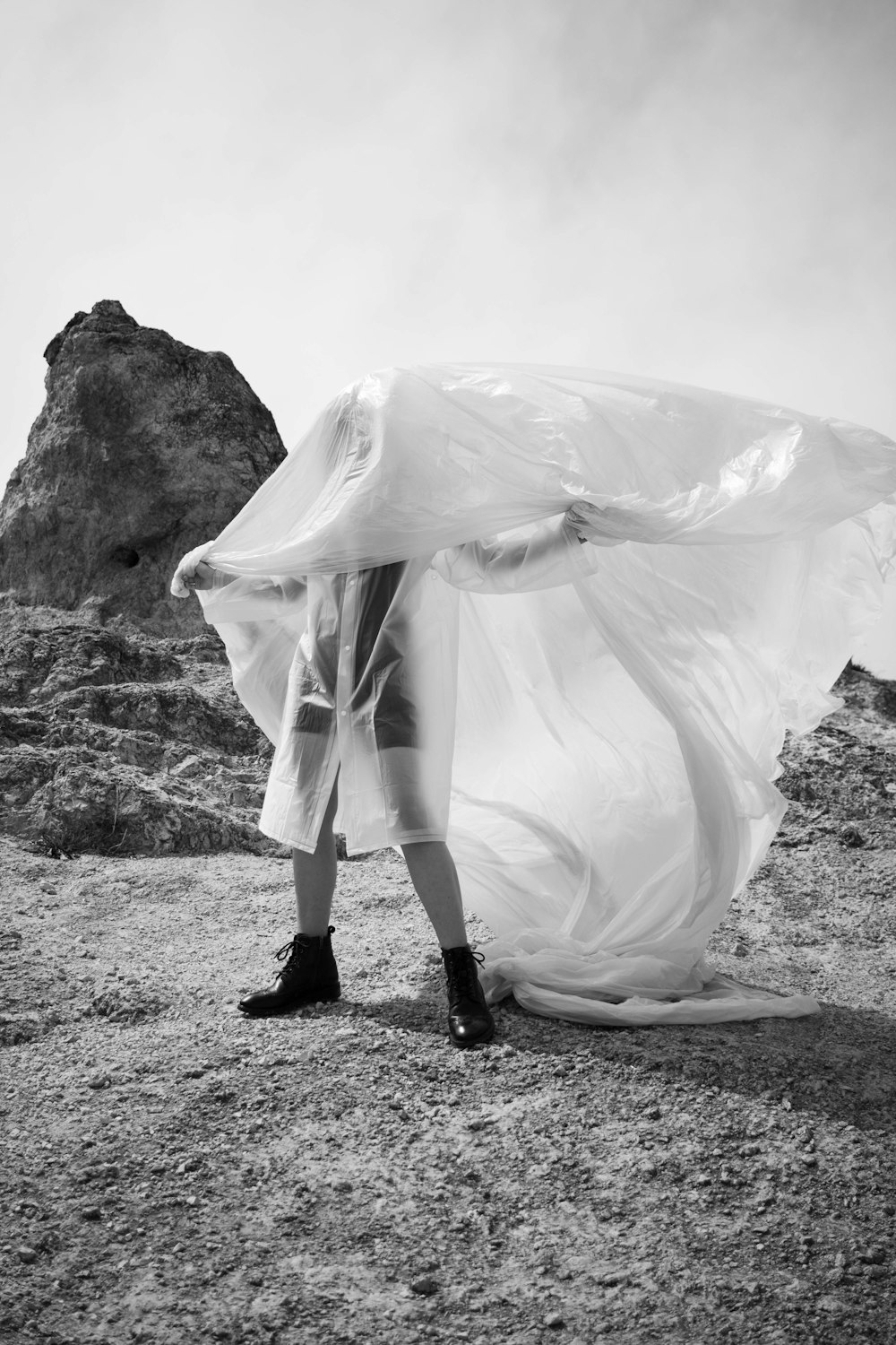 person in white dress standing on ground