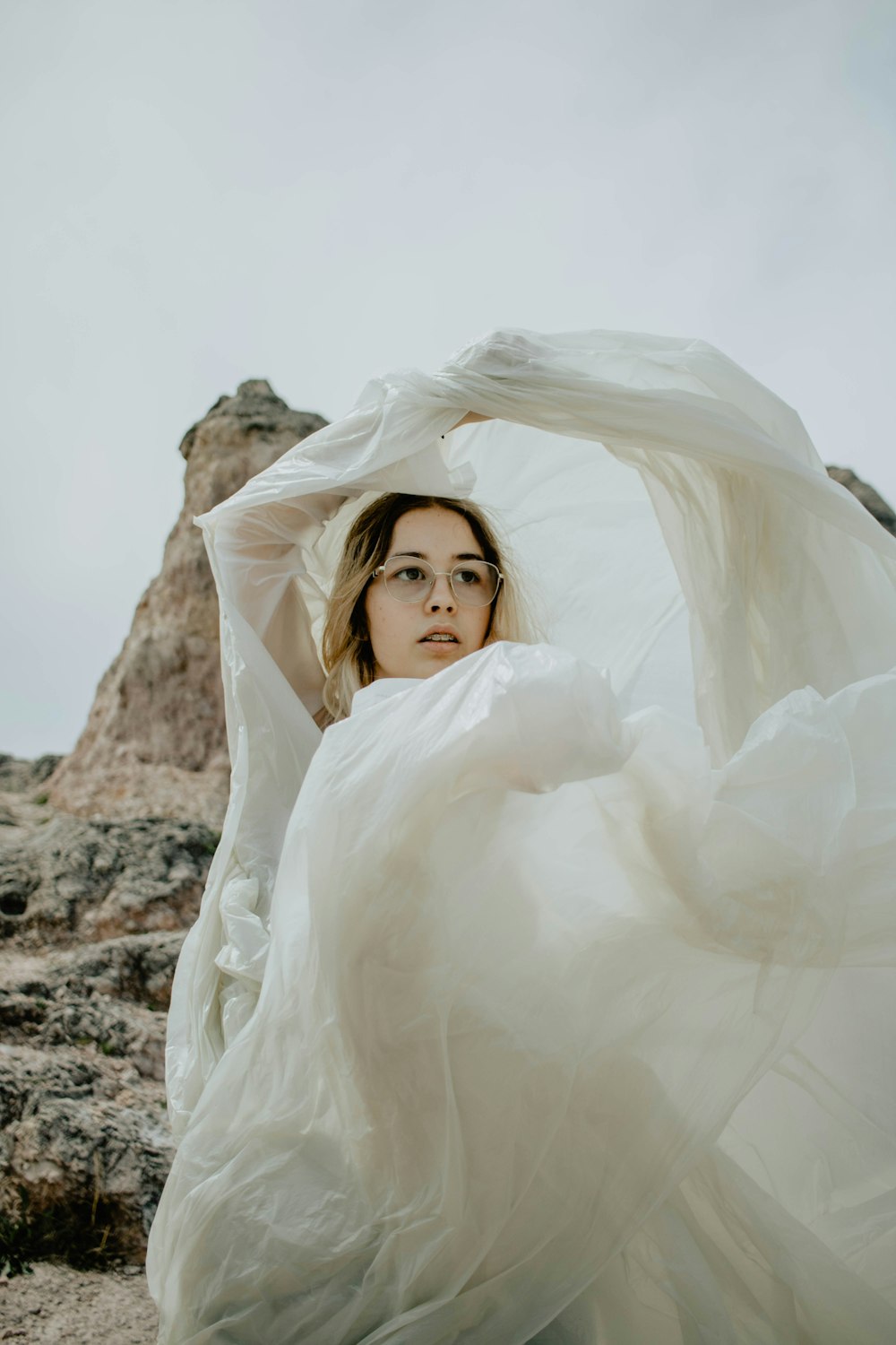 woman covered with white textile