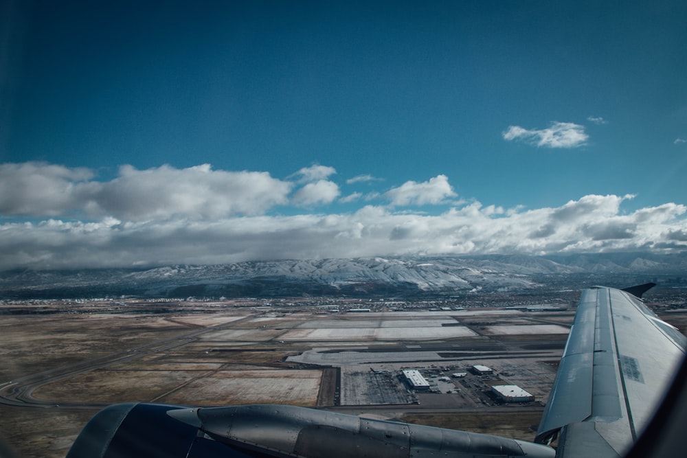 aerial view of city under cloudy sky during daytime