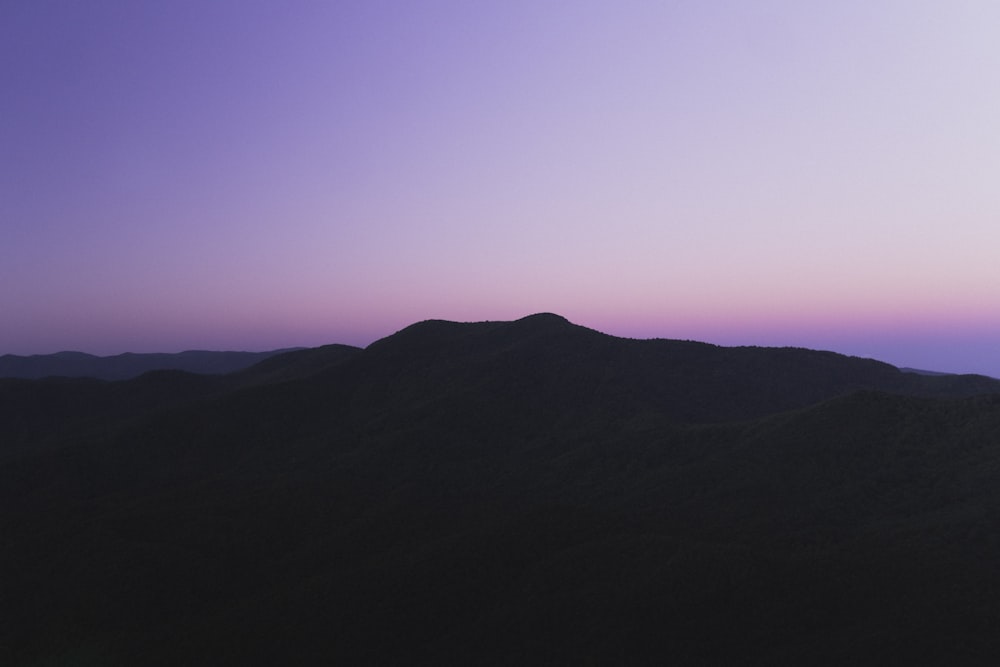 silhouette of mountain during sunset