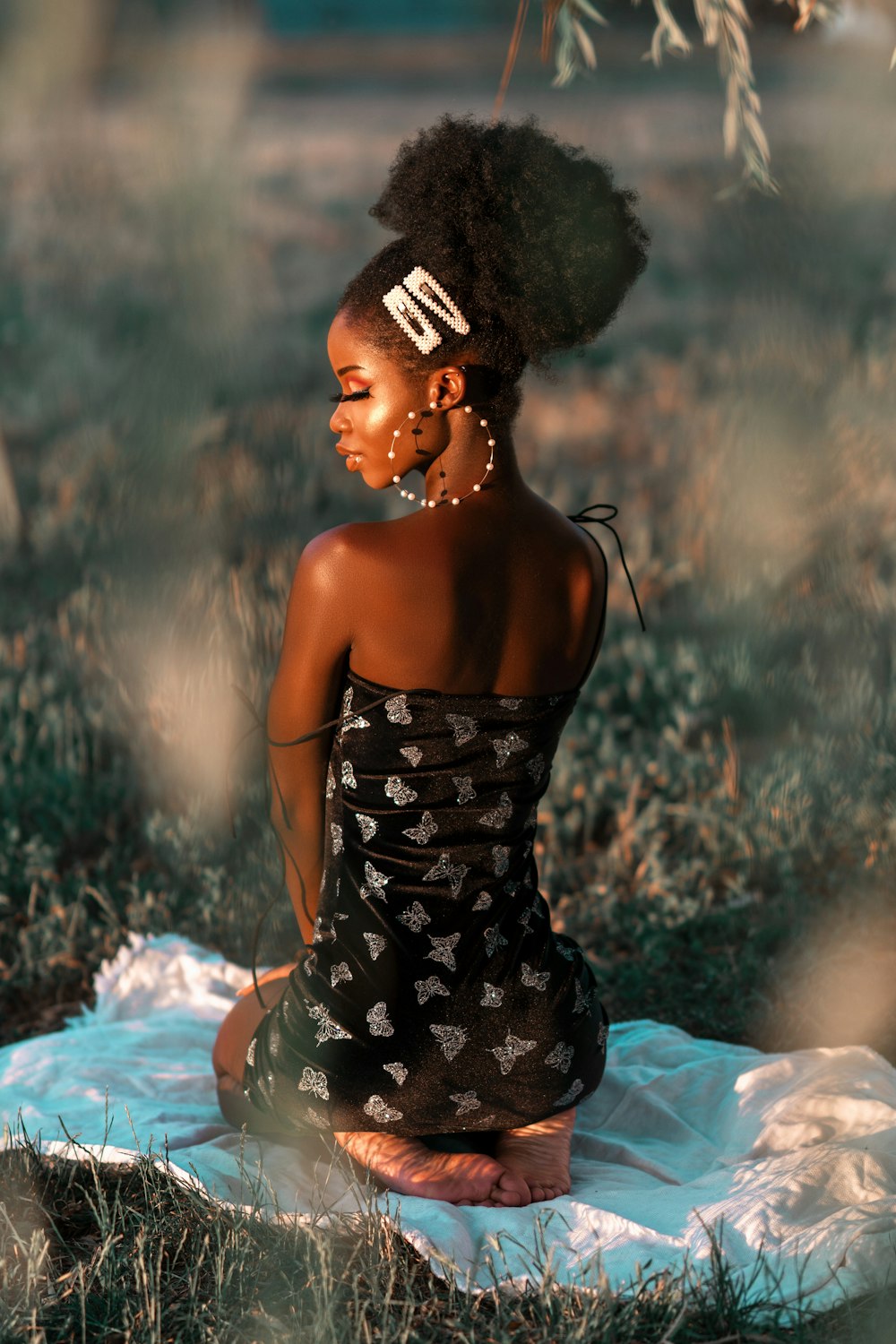 woman in black and white floral tube dress