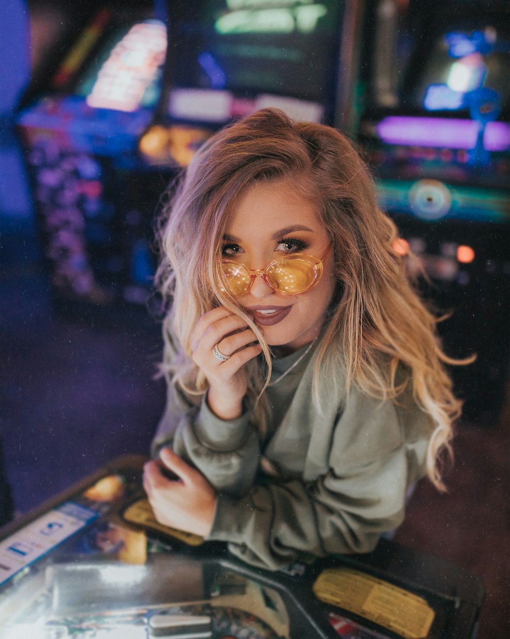 girl in gray jacket wearing brown framed eyeglasses