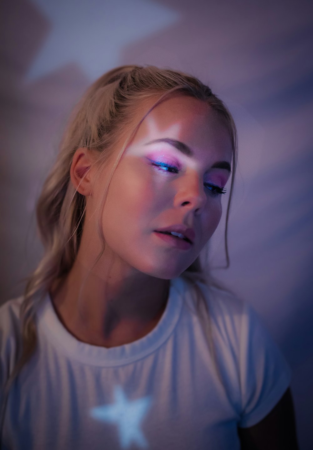 woman in white crew neck shirt with blue eyes