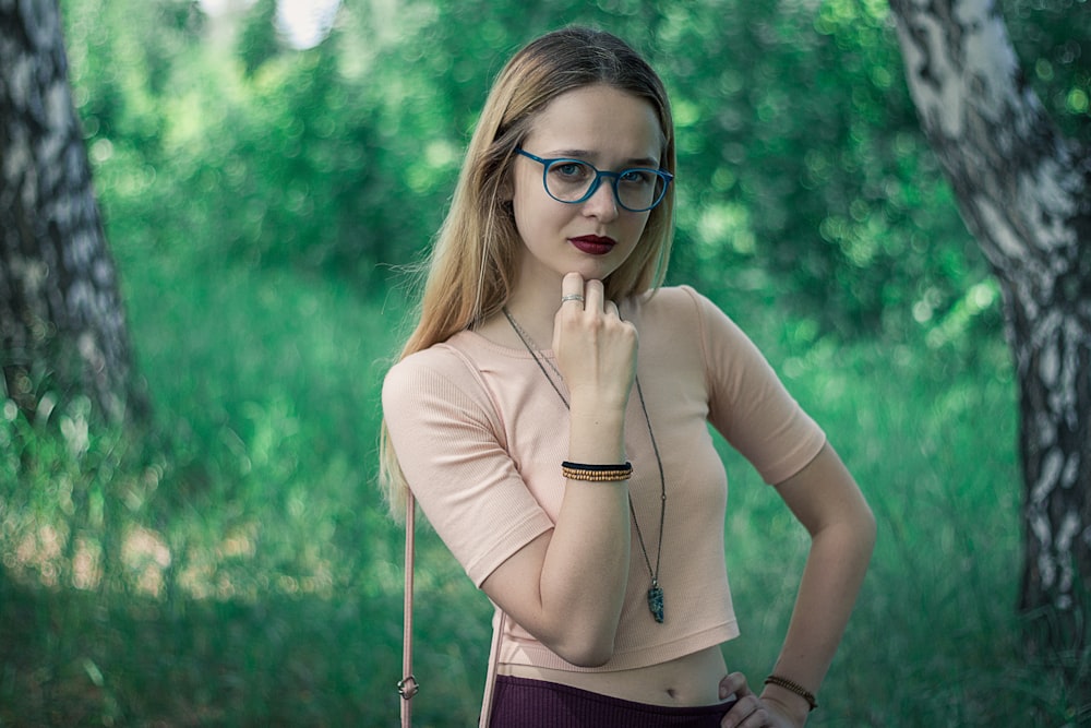 woman in brown long sleeve shirt wearing black framed eyeglasses