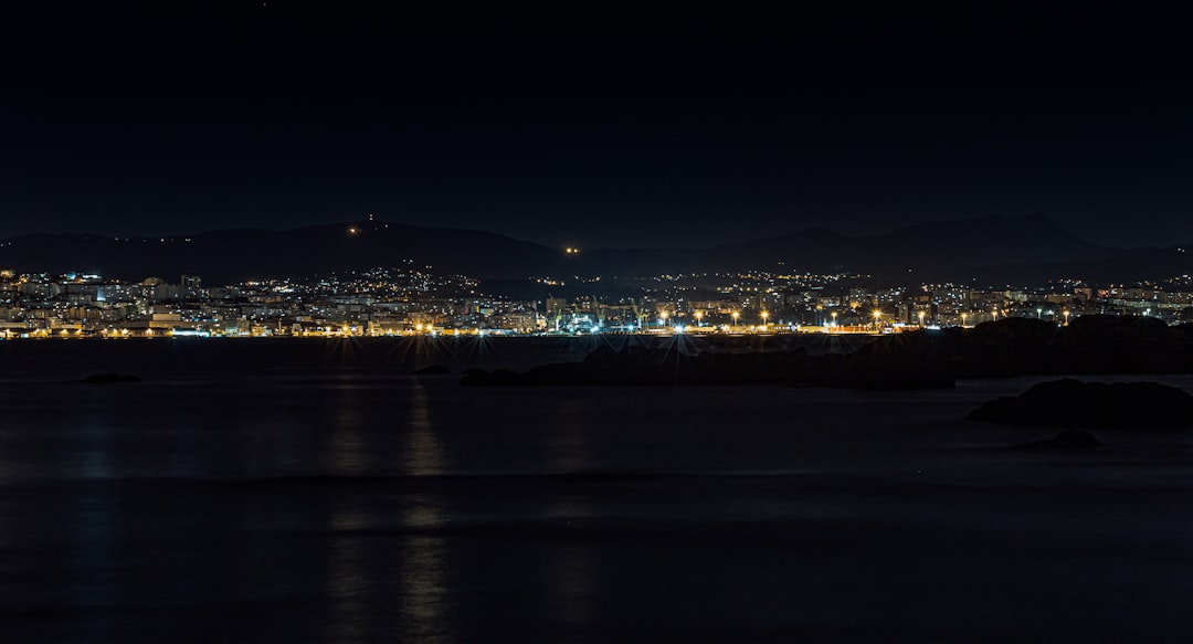 city lights turned on during night time