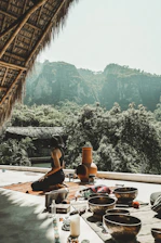 Peaceful outdoor terrace with massage setup overlooking Ibiza's natural landscape.