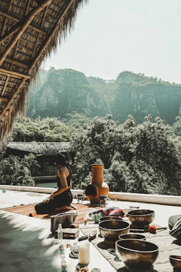 A tranquil outdoor yoga setup blending Austrian nature with Spanish decorative elements.