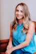 smiling girl in blue sleeveless dress