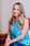 smiling girl in blue sleeveless dress