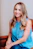 smiling girl in blue sleeveless dress