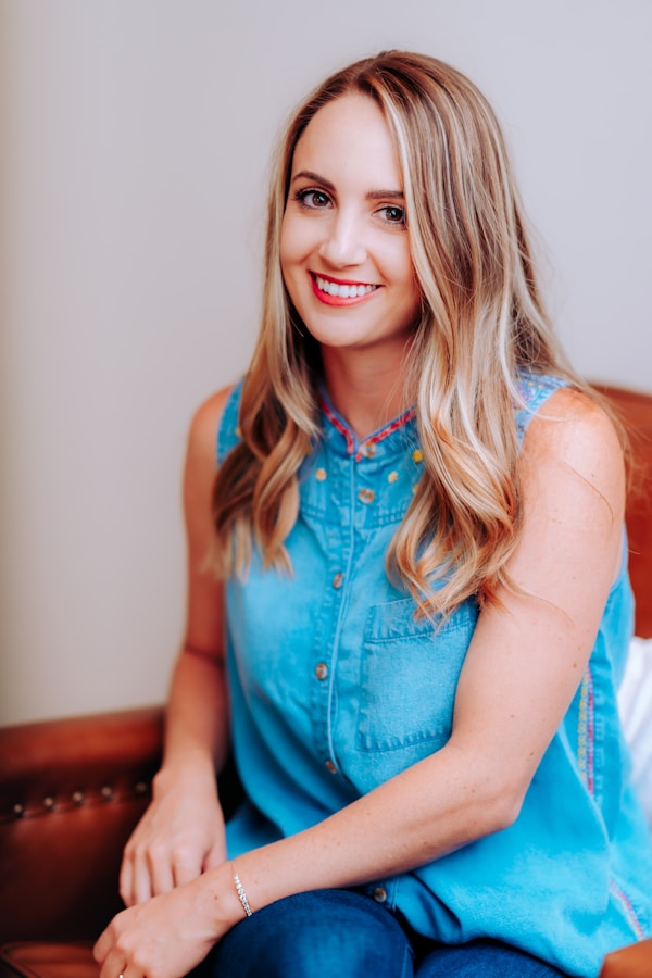 smiling girl in blue sleeveless dressby Meritt Thomas