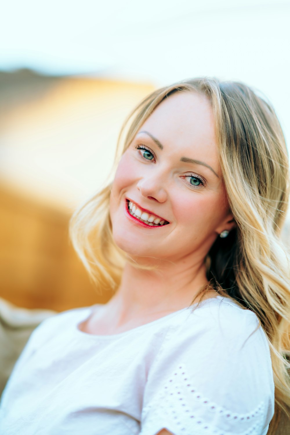 smiling girl in white crew neck shirt