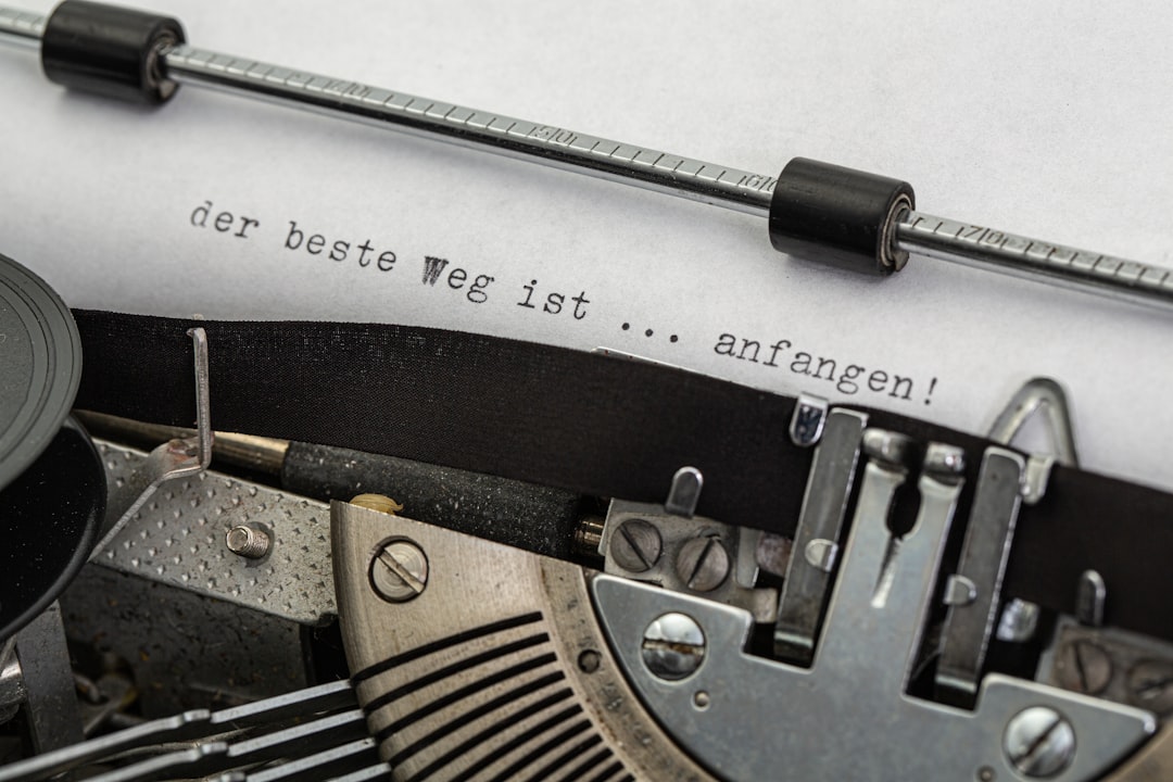 black and gray typewriter on white printer paper