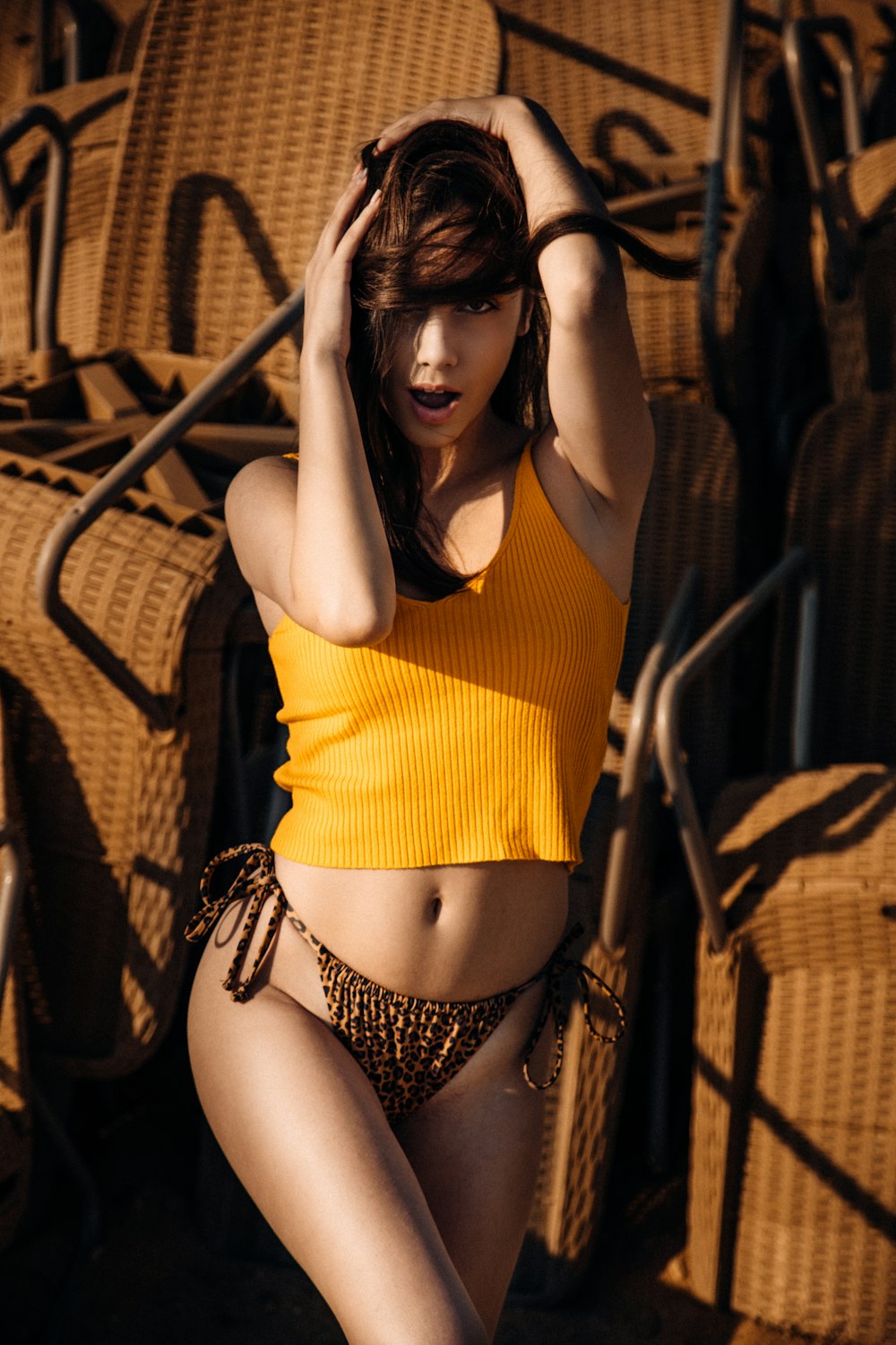 woman in yellow tank top and black and white leopard panty