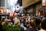 A vibrant thumbnail showing a lively street performance.