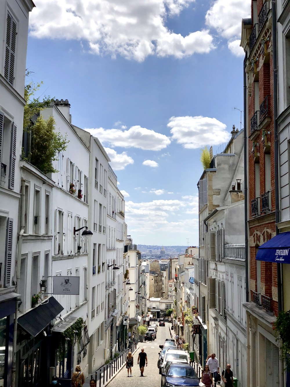 white concrete buildings under blue sky during daytime