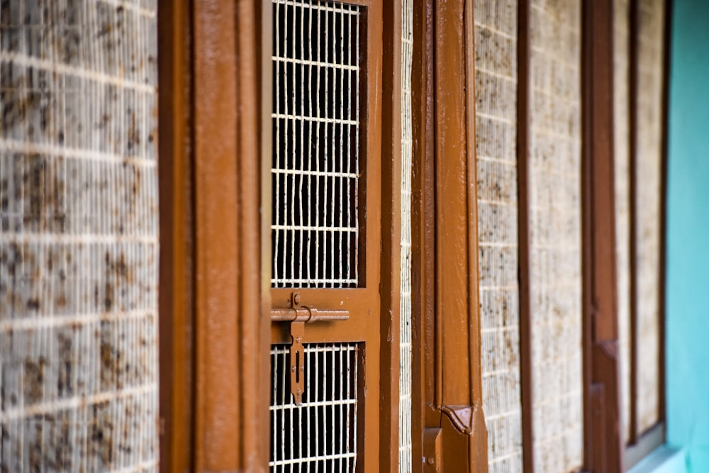 brown wooden window frame on brown wooden wall