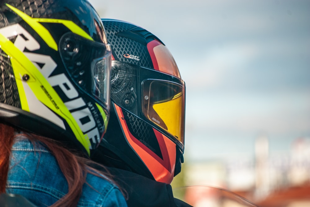 person wearing black yellow and white helmet