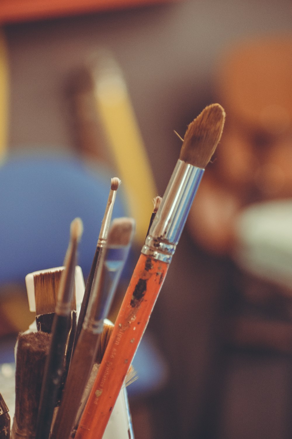 makeup brushes on blue textile