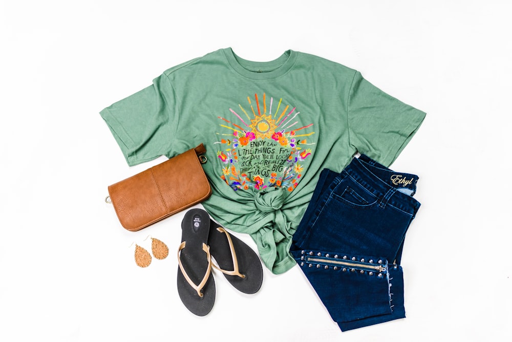 green crew neck t-shirt and blue denim shorts