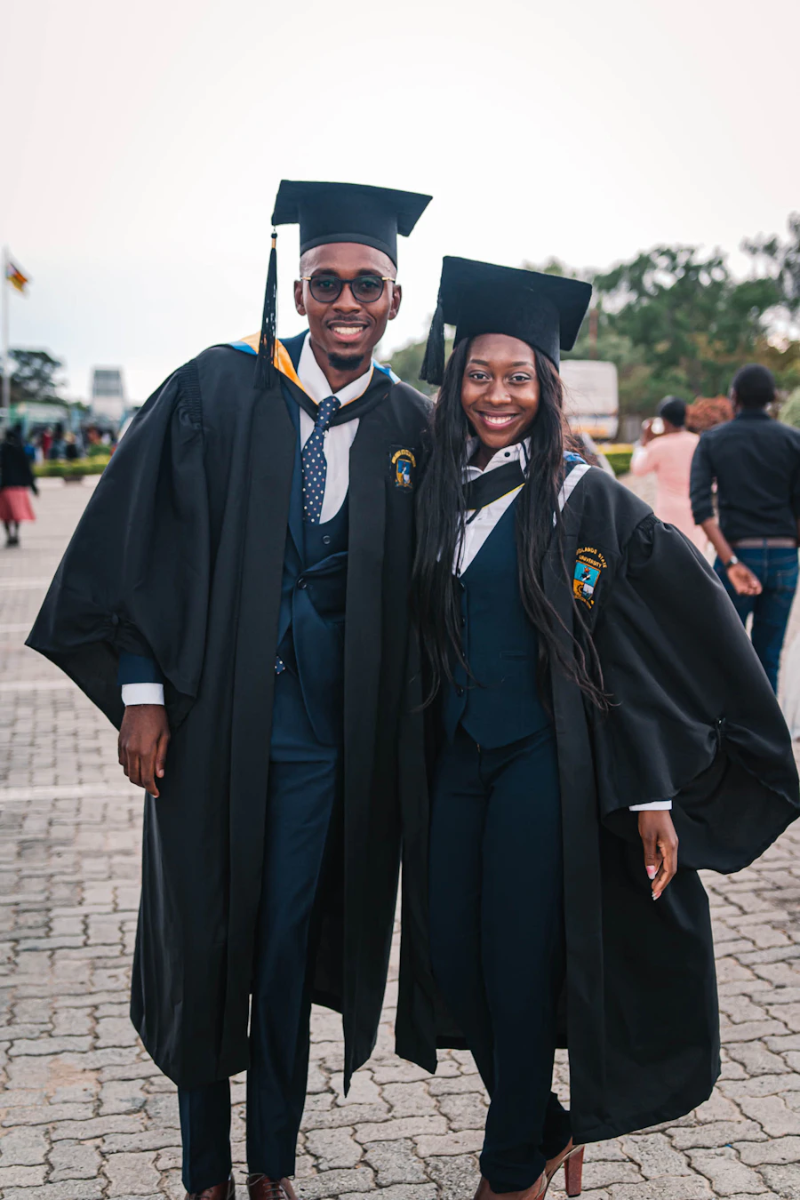 Graduate in academic gown celebrating achievement