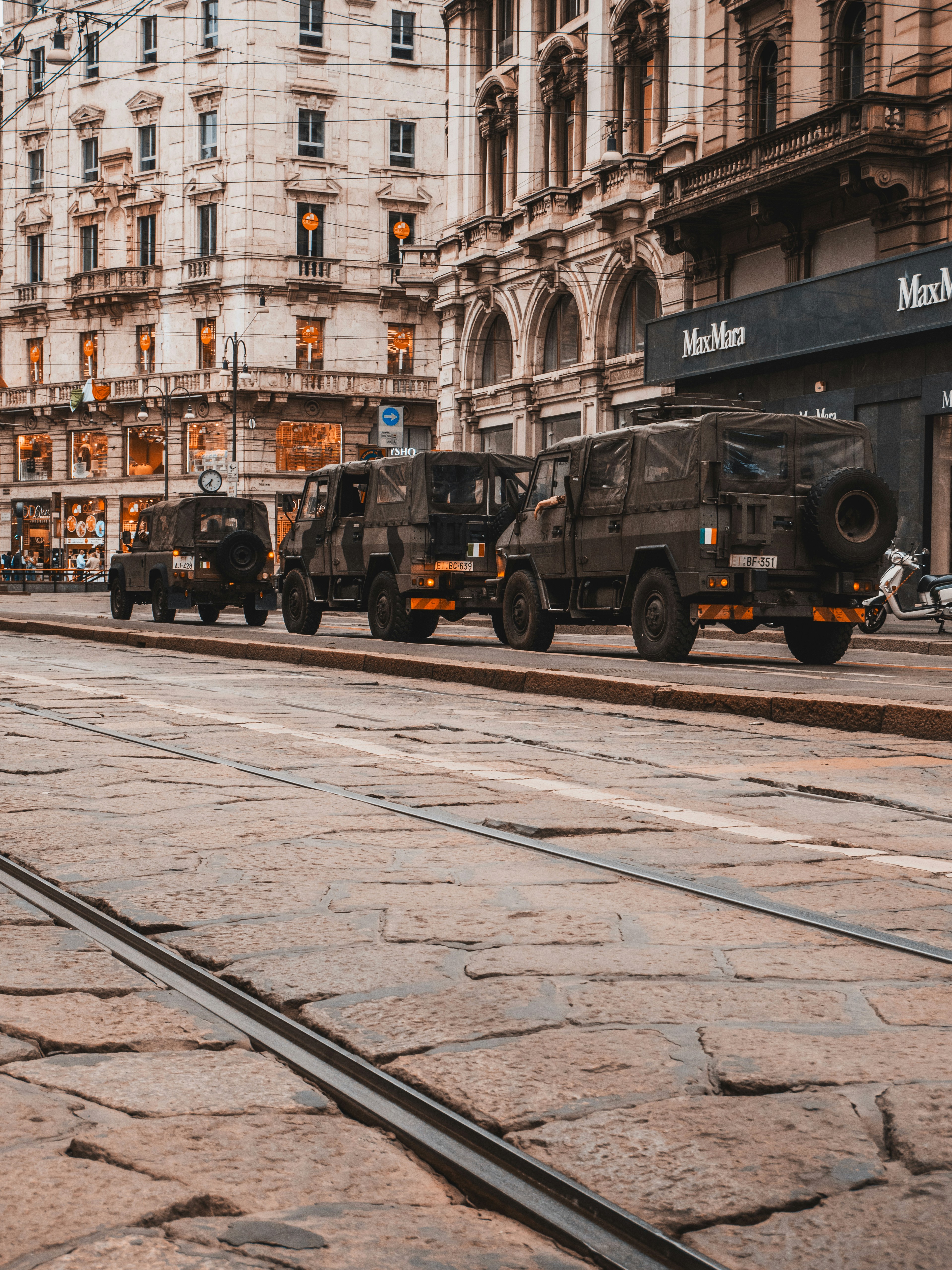 black and yellow truck on road near building during daytime