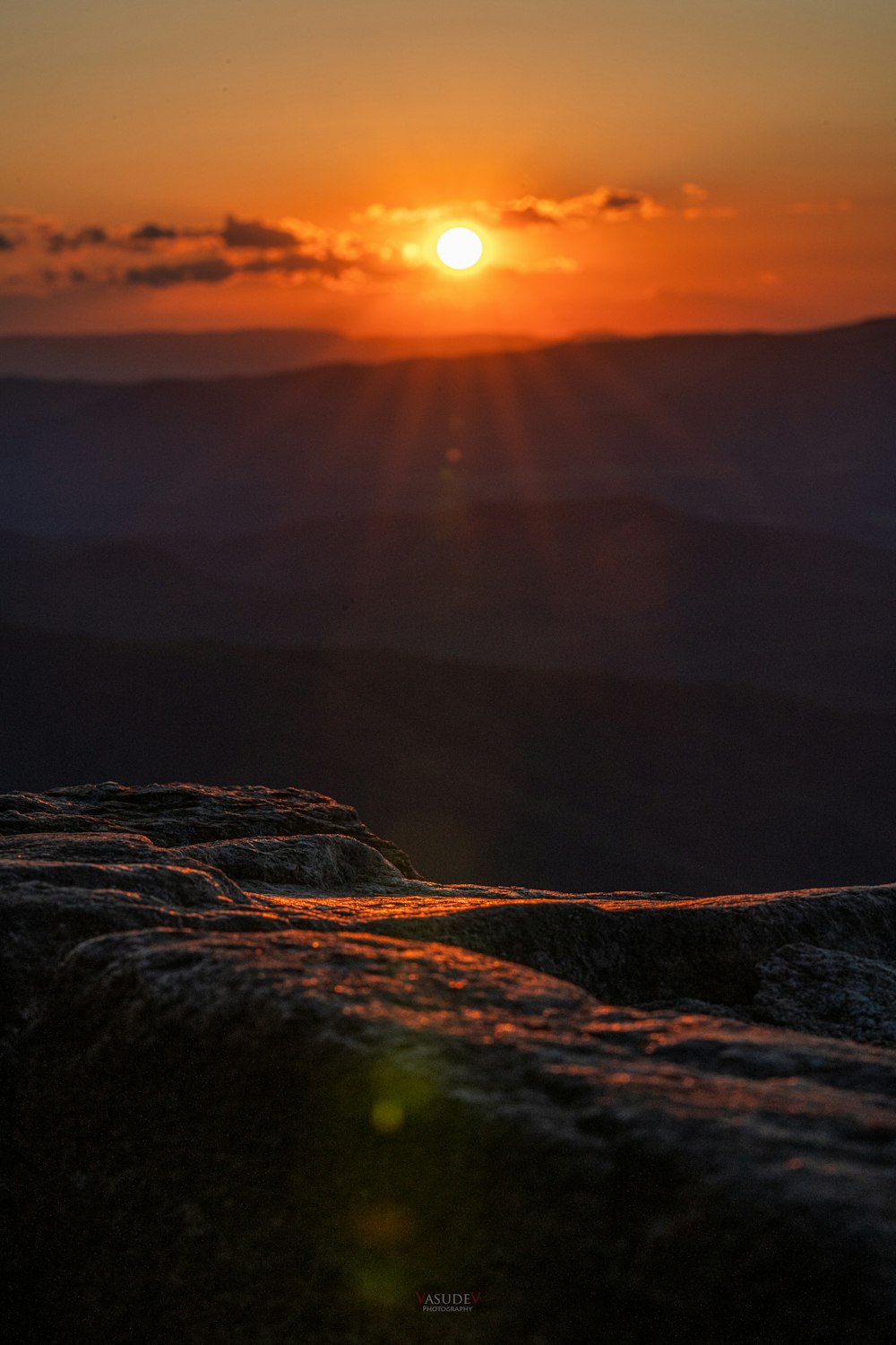 brown mountain under orange sky during sunset