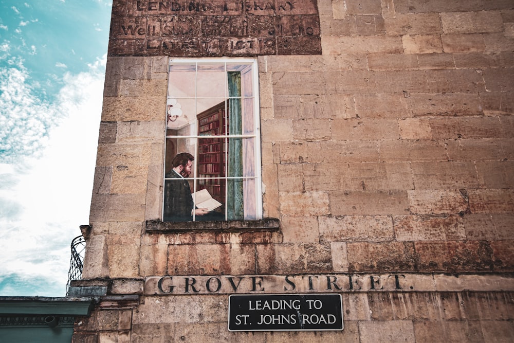 brown brick building with glass window