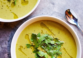 green soup on white ceramic bowl