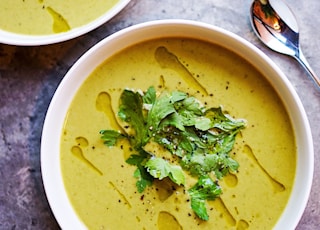 green soup on white ceramic bowl